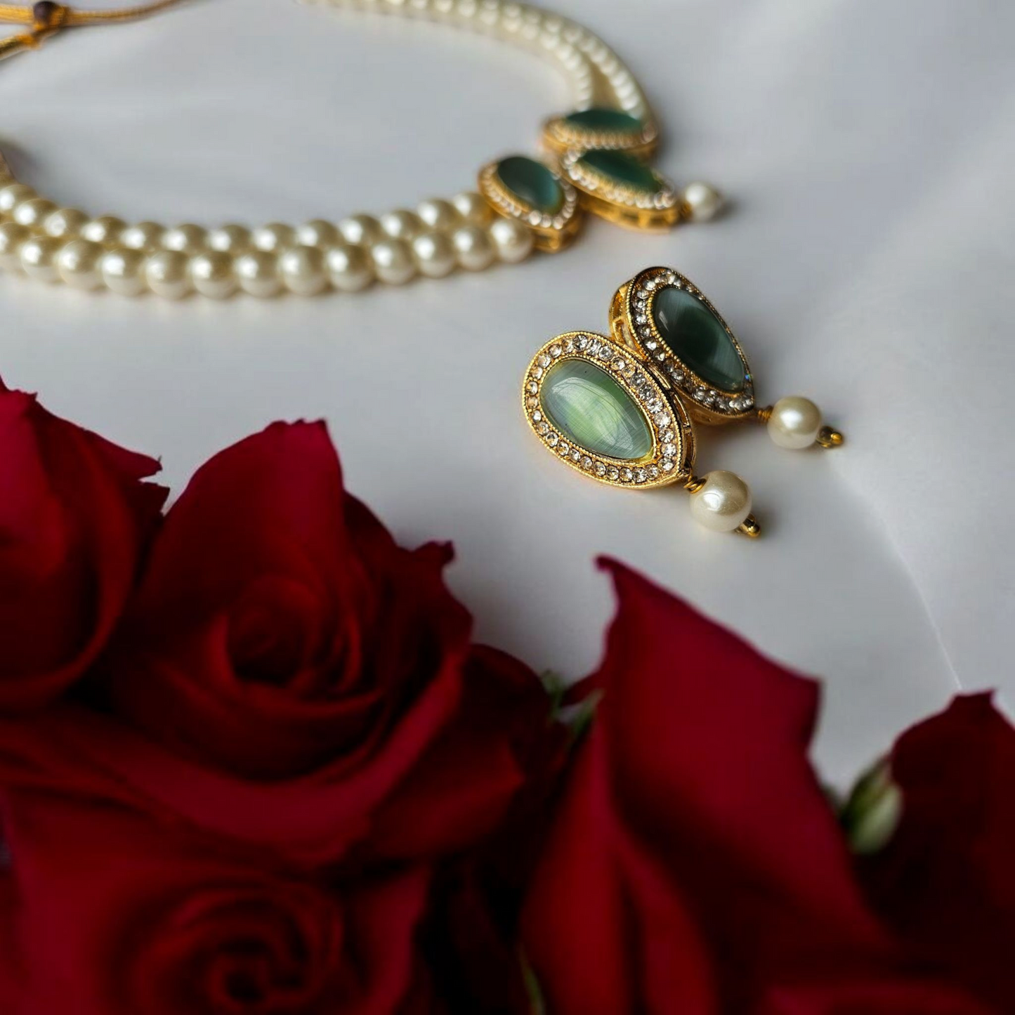 Kundan choker necklace for women with green stones and pearl earrings from Anusangi Collections