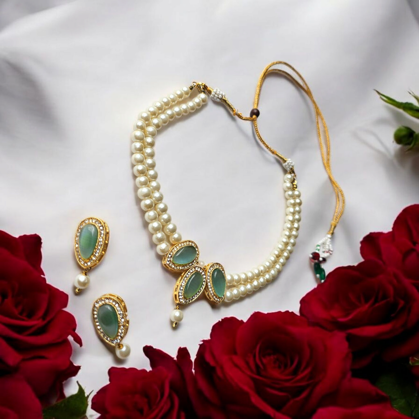 Kundan choker necklace for women with pearl beads and green stone accents from Anusangi Collections