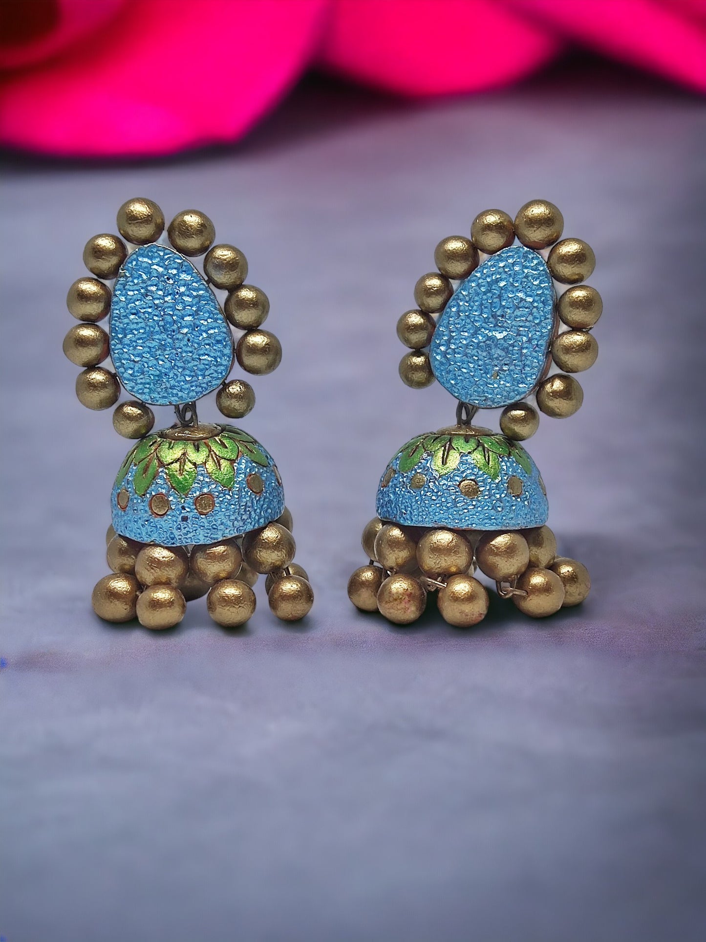 Anusangi Collections Lakshita terracotta jhumka earrings in blue and gold with decorative detailing