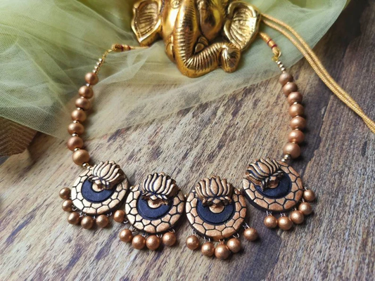 Lotus Malhar Terracotta Necklace from Anusangi Collections with intricate lotus design and bead detailing