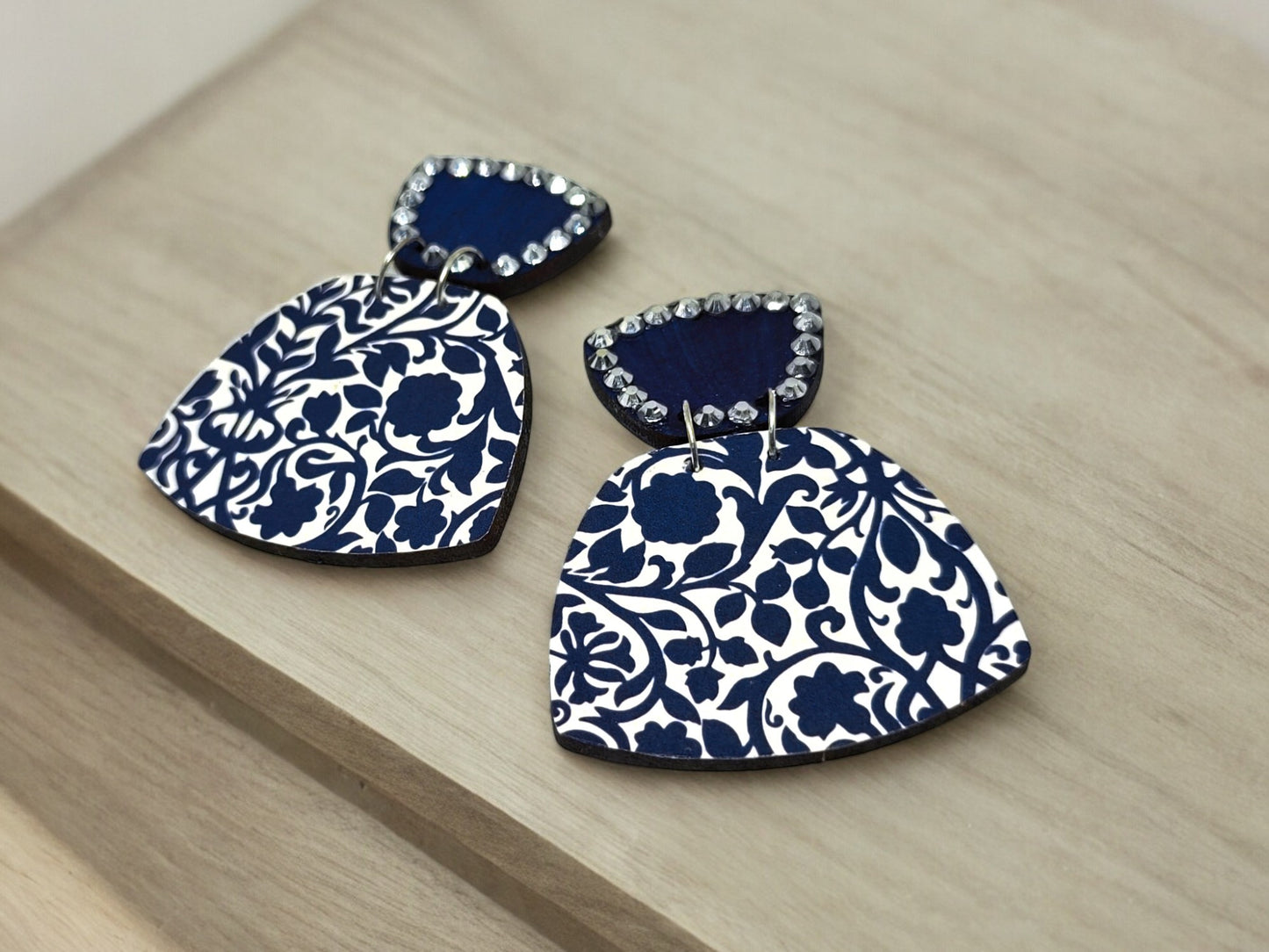 Anusangi Collections navy blue white handmade earrings with intricate floral pattern and rhinestone detail