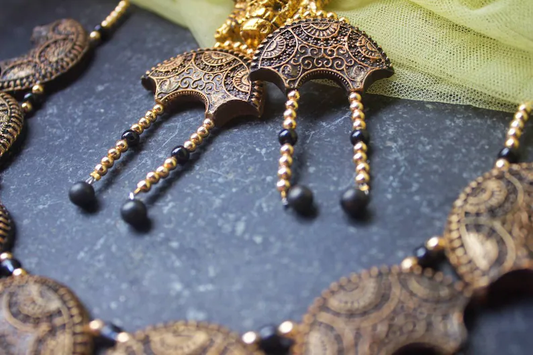 Anusangi Collections terracotta Noor-E-Jahaan necklace set with intricate gold and black bead detailing