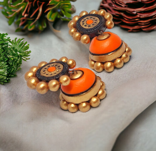 Orange ethnic terracotta jhumka designs with golden bead accents by Anusangi Collections