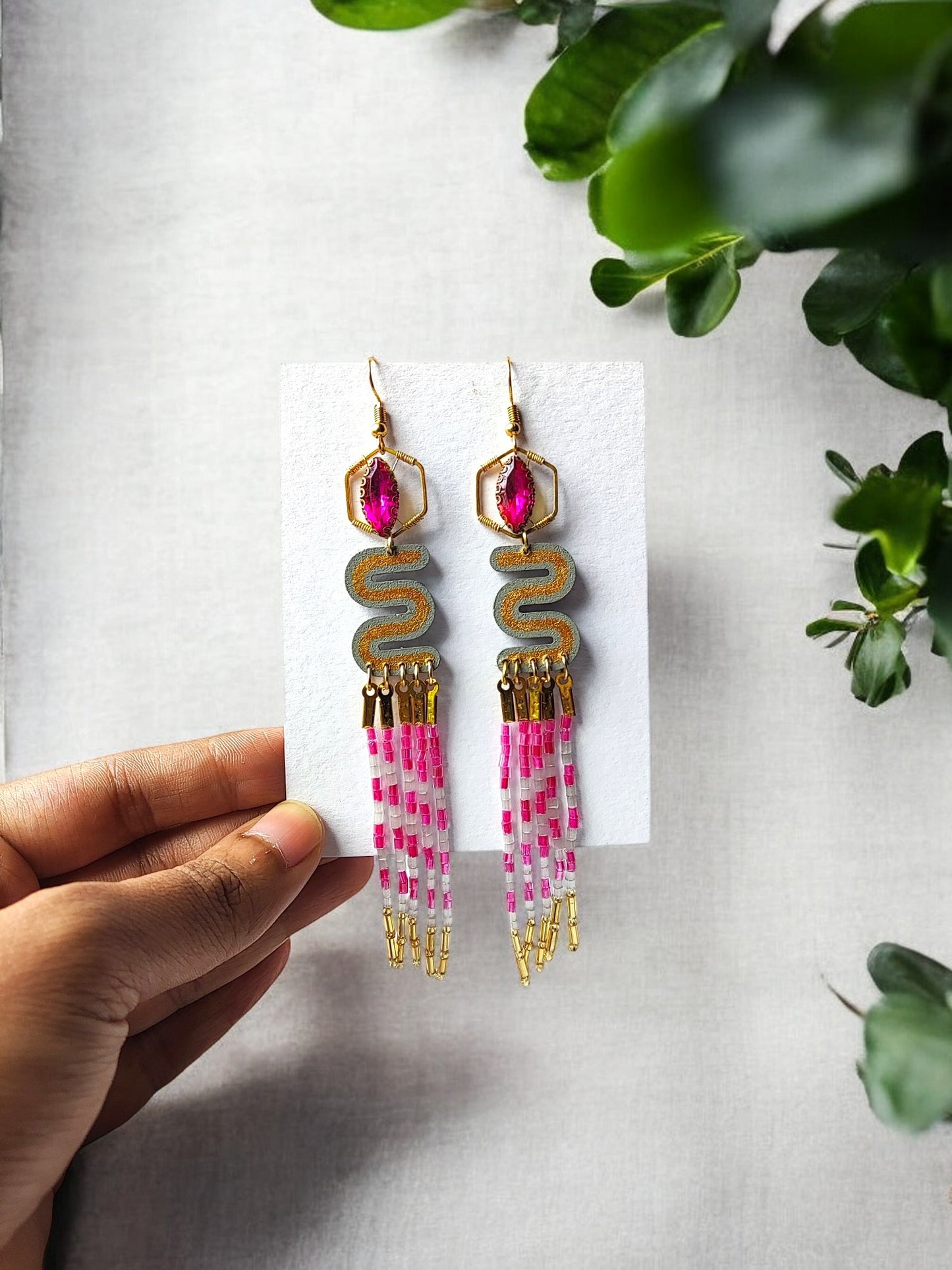 Anusangi Collections pink and gold dangle earrings with intricate beading and fringe design