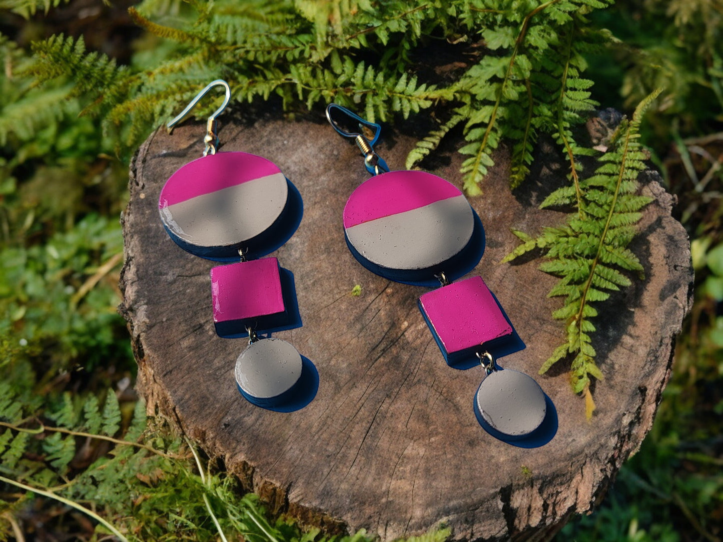 Pink and gray statement earrings terracotta set from Anusangi Collections displayed on tree stump with greenery