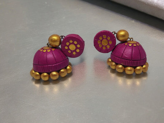 Pink terracotta jhumka earrings with gold bead accents from Anusangi Collections
