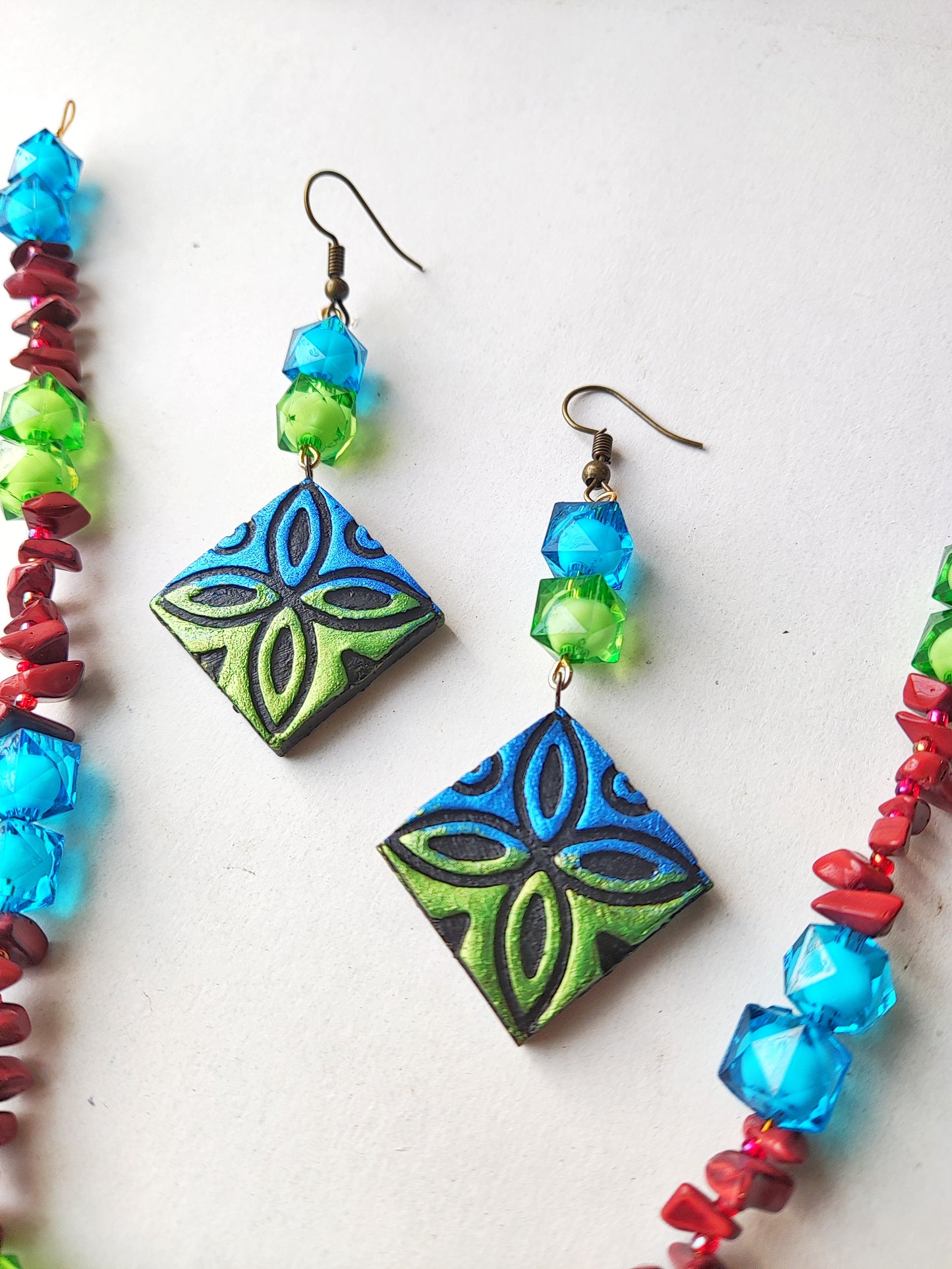 Anusangi Collections psychedelic zentangle jewelry set featuring terracotta earrings with blue and green patterns