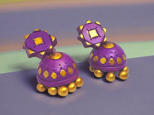 Purple terracotta earrings from Anusangi Collections featuring gold accents and intricate design