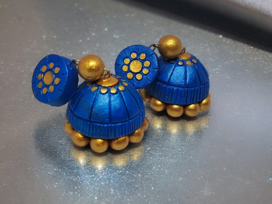 Royal blue terracotta jhumka earrings with golden bead details from Anusangi Collections