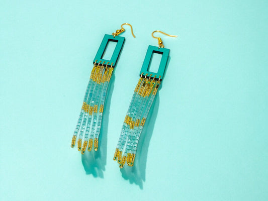 Sea green beaded earrings from Anusangi Collections with rectangular top and tassel bead design