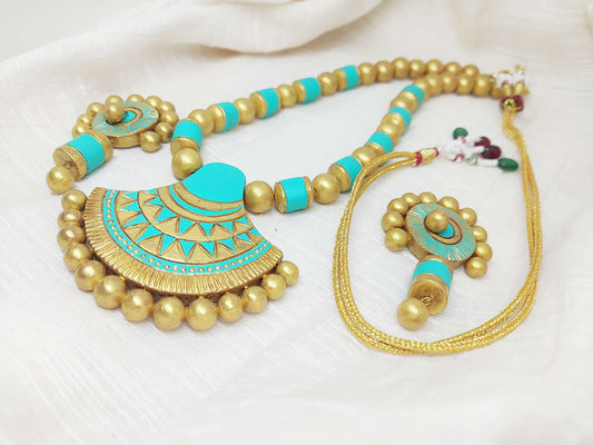 Sea green terracotta jewelry set from Anusangi Collections featuring necklace and earrings with gold accents