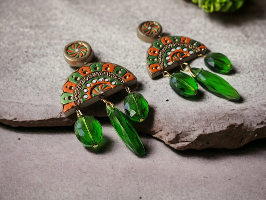 Shakuntala terracotta earrings with green bead drops and intricate orange and green design by Anusangi Collections