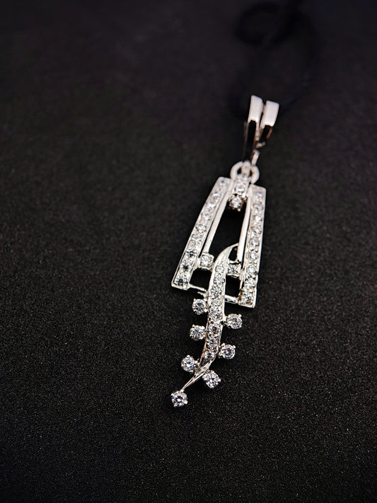 Sterling silver leaf pendant with sparkling stones from Anusangi Collections on black background