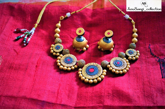 Sudarshana necklace handmade terracotta jewelry set from Anusangi Collections with intricate circular designs