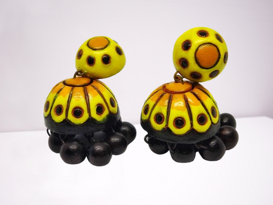 Titli terracotta jhumka earrings in yellow and black by Anusangi Collections with intricate hand-painted design