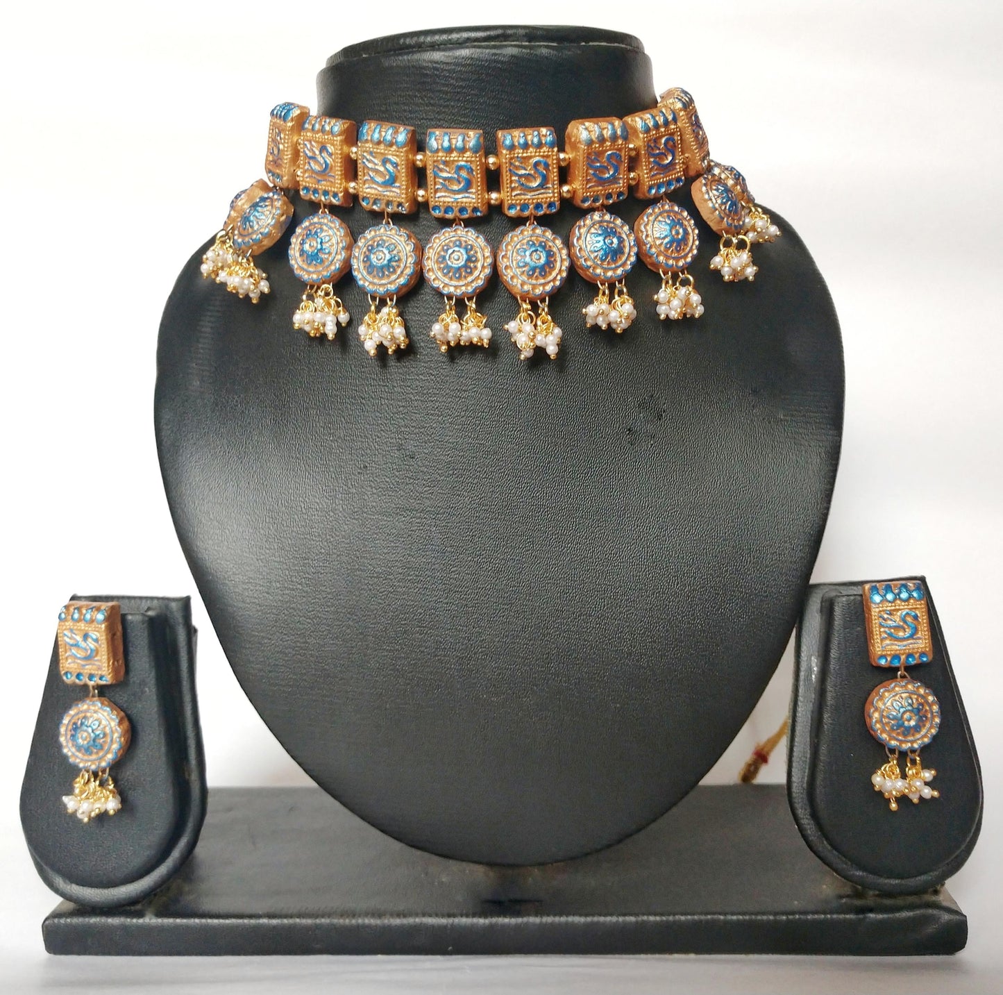 Anusangi Collections terracotta jewelry set featuring a traditional fabric choker necklace with matching earrings