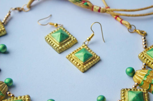 Anusangi Collections traditional golden necklace set with terracotta green and gold square earrings