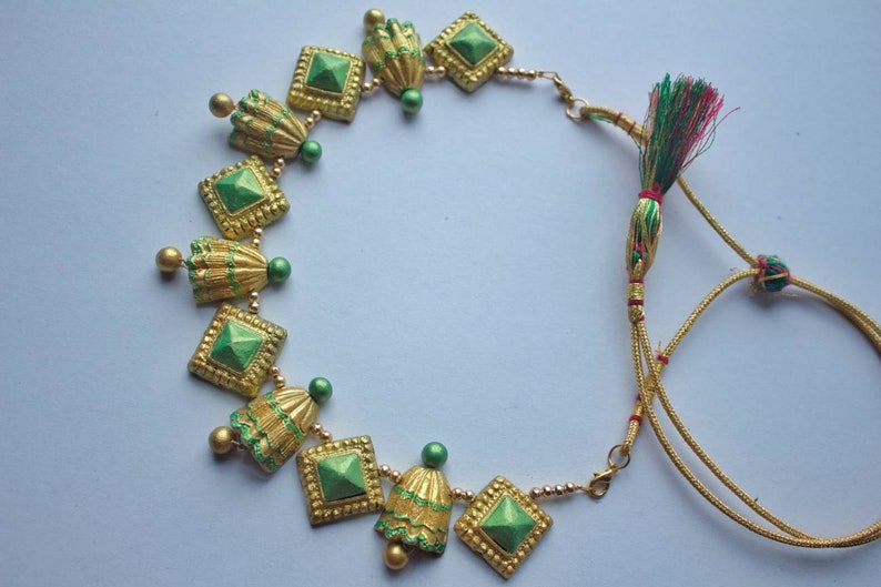 Traditional Golden Necklace Set terracotta jewelry with green and gold details by Anusangi Collections