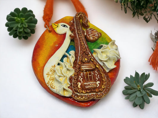 Anusangi Collections traditional Rajhans pendant set for women featuring vibrant fabric jewelry with unique bird and instrument design
