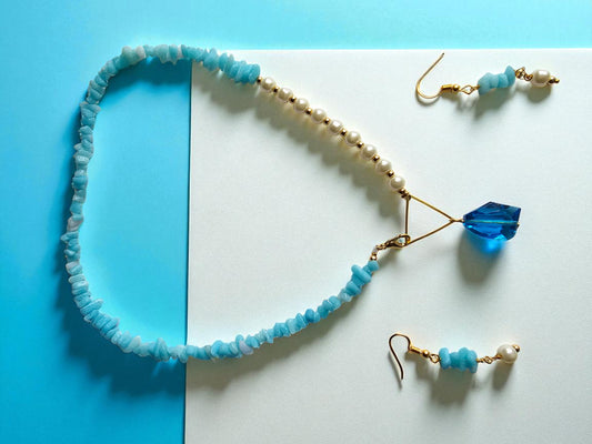 Anusangi Collections uncut beads pearl jewelry set featuring a blue necklace and matching earrings