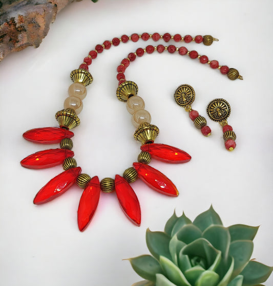 Unique red statement necklace set from Anusangi Collections with bold red beads and matching earrings