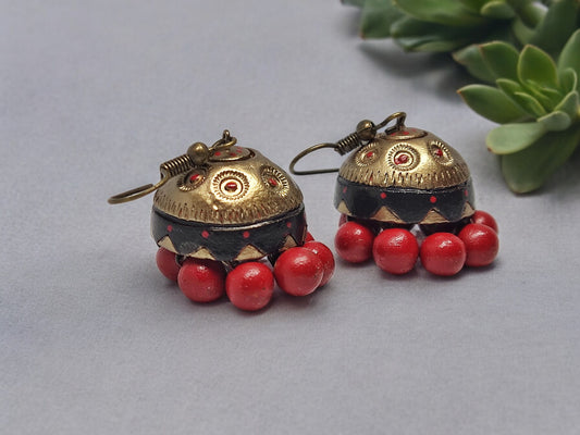 Vaidehi terracotta earrings from Anusangi Collections featuring antique gold tones and red bead accents