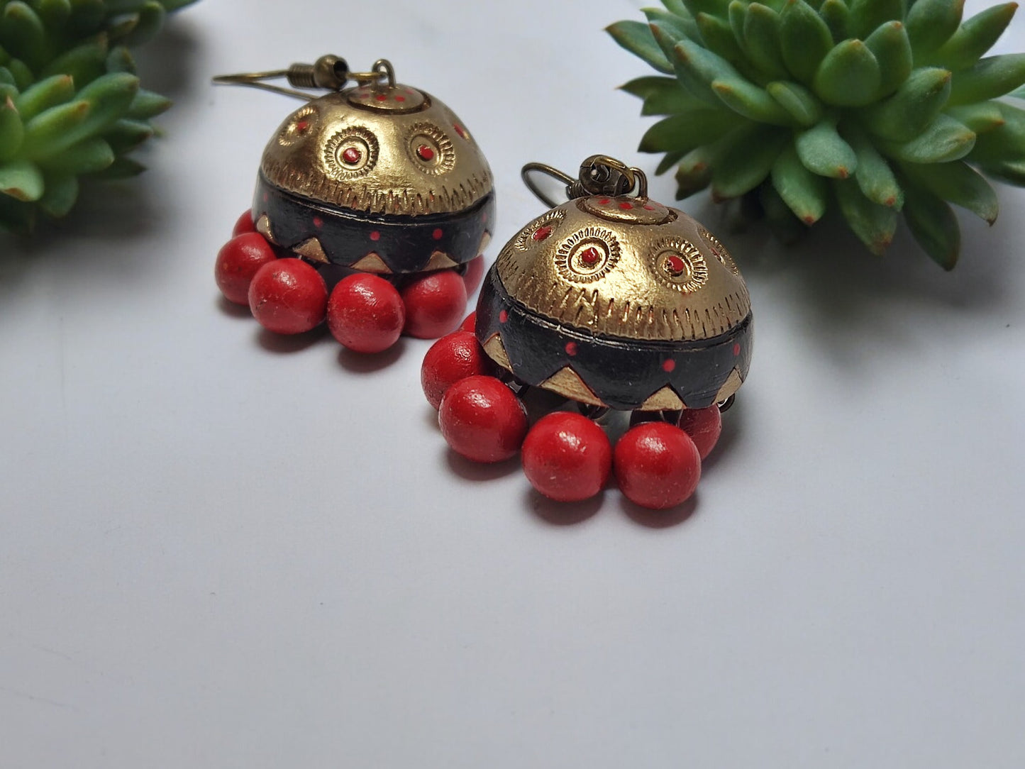 Vaidehi terracotta earrings with red beads and antique gold detailing from Anusangi Collections