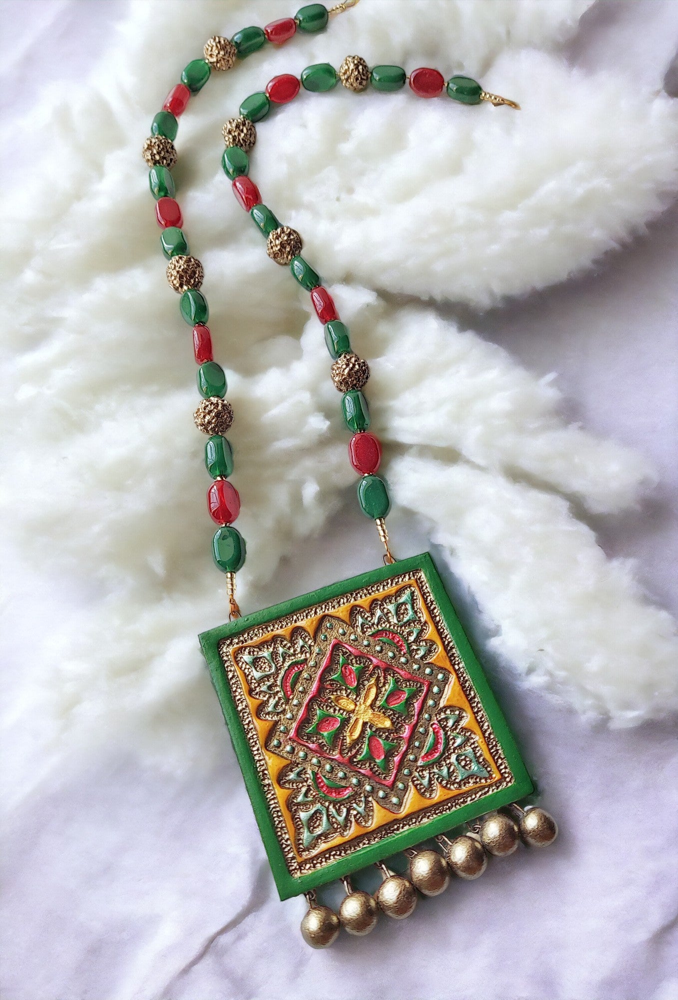 Vasudha terracotta necklace and earrings with green red beads and intricate handcrafted pendant by Anusangi Collections