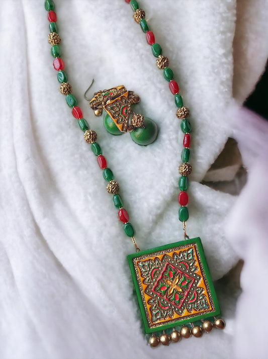 Vasudha terracotta necklace and earrings set with green and red beads and intricate square pendant