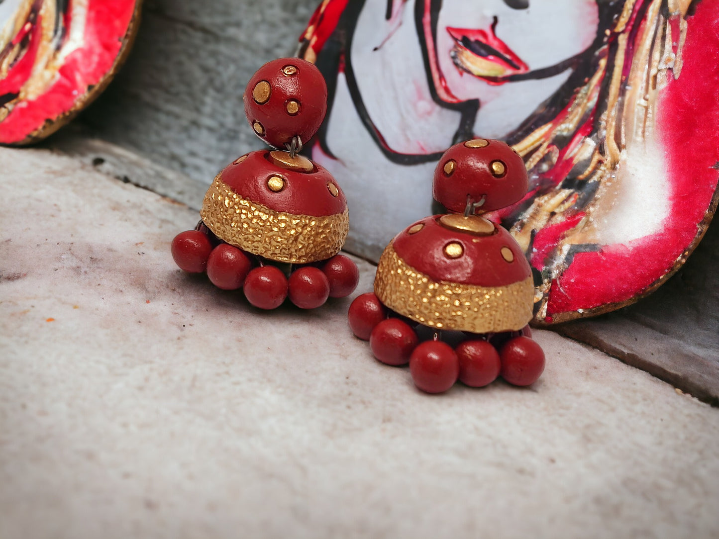 Vasundhara terracotta earrings by Anusangi Collections in red and gold with bead detailing