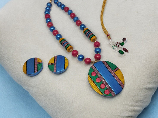 Colorful Atishi necklace and earrings terracotta jewelry set by Anusangi Collections with vibrant beads and geometric pendant