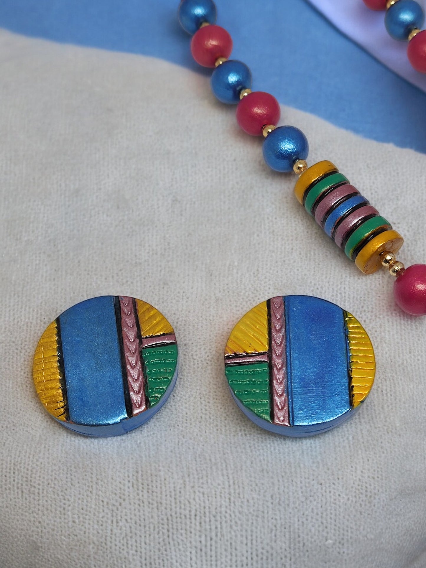 Colorful Atishi necklace and earrings terracotta jewelry set by Anusangi Collections with vibrant geometric design