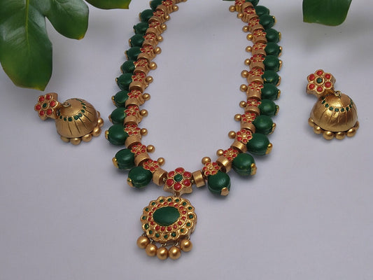 Grand terracotta necklace and earrings set by Anusangi Collections with green and gold detailing