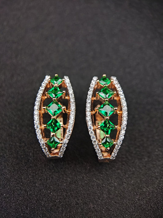 Elegant green sterling silver earrings with square green stones and surrounding clear crystals