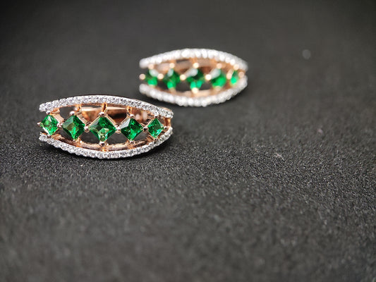 Anusangi Collections green sterling silver earrings with sparkling green gemstones and intricate silver detailing