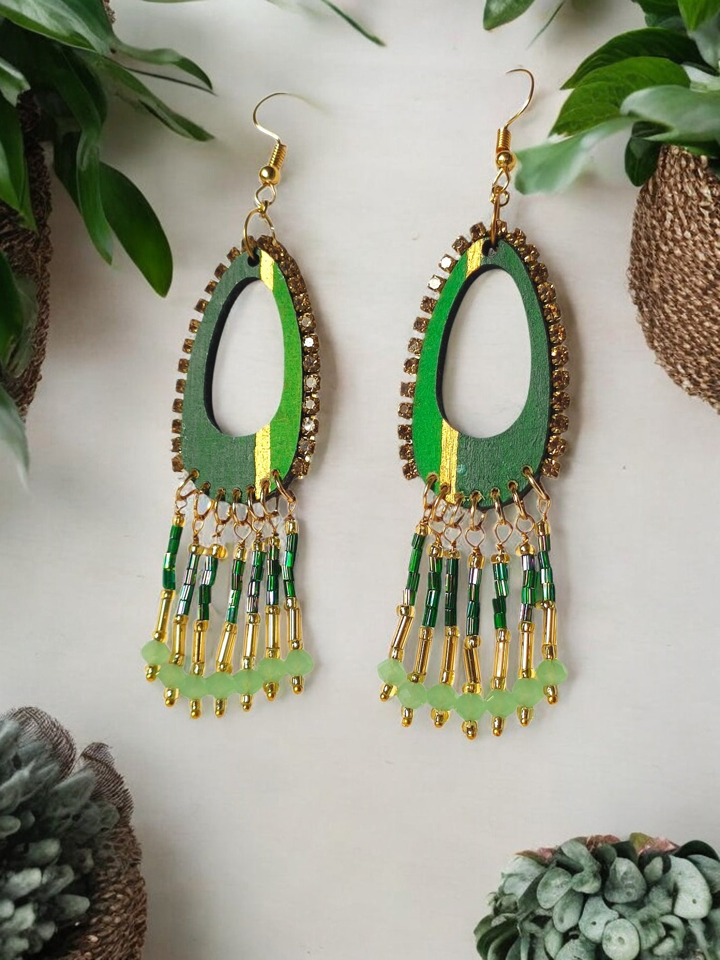 Shades of green dangle earrings with gold accents and beaded fringes from Anusangi Collections