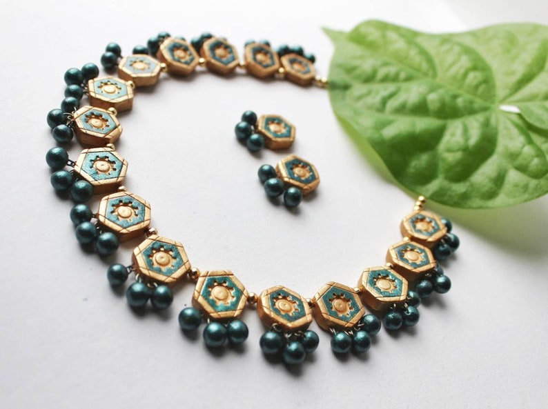 Viridescent Green Glory Necklace terracotta jewelry set by Anusangi Collections with hexagonal design and green beads