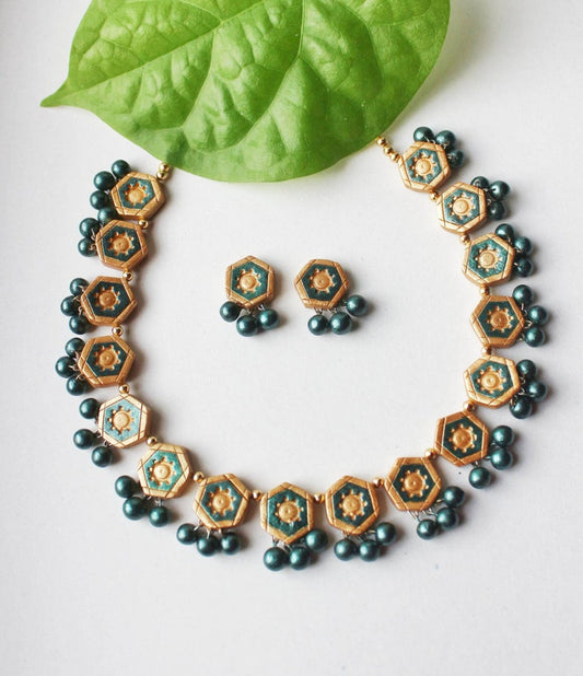 Anusangi Collections terracotta jewelry set featuring Viridescent Green Glory Necklace with matching earrings