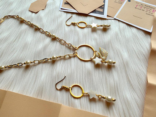 Anusangi Collections white pearl station necklace for women with gold accents and star charms