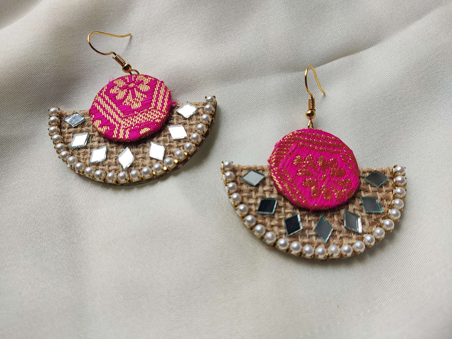 Colorful fabric earrings for women featuring pink embroidered fabric and pearl accents on a lightweight design