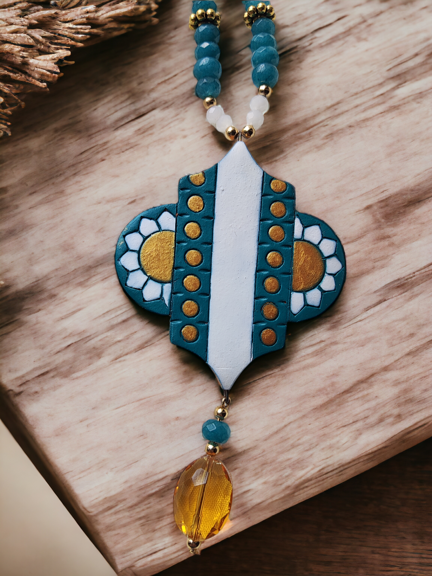 Discover the intricate beauty of the Advika Terracotta jewelry set. Handmade with a Terracotta pendant, Agate and onyx beads, and metal beads, this set boasts a unique blend of craftsmanship and elegant design. Elevate your style with this one-of-a-kind jewelry set.