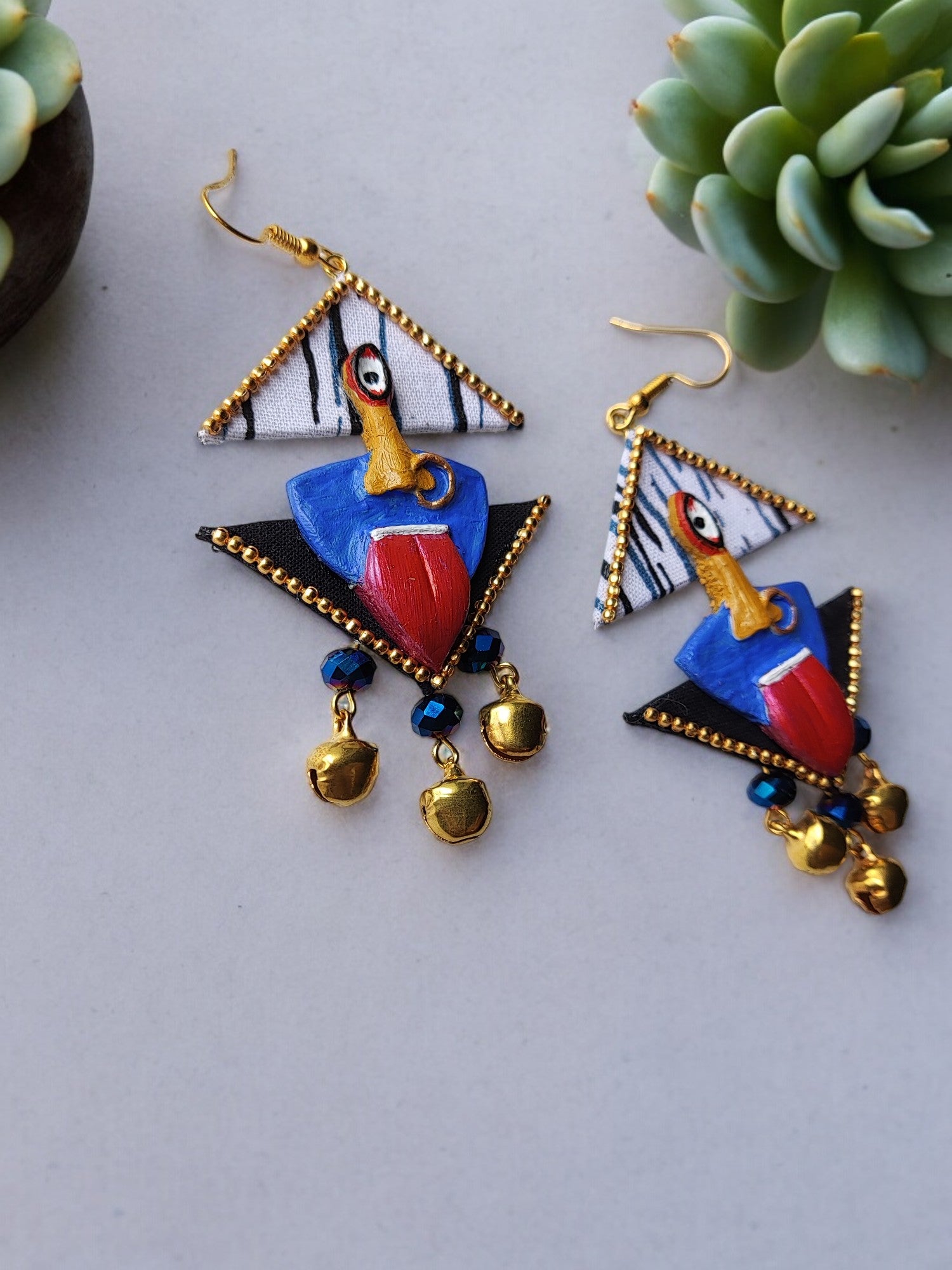 <p data-mce-fragment="1">Discover the divine elegance of Kaalika Fabric Earrings. Each pair in this unique collection is expertly crafted with a fabric and clay combination, inspired by the powerful goddess Kali ma. Elevate any outfit with these exclusive, one-of-a-kind pieces. Experience luxury and style like never before.</p>