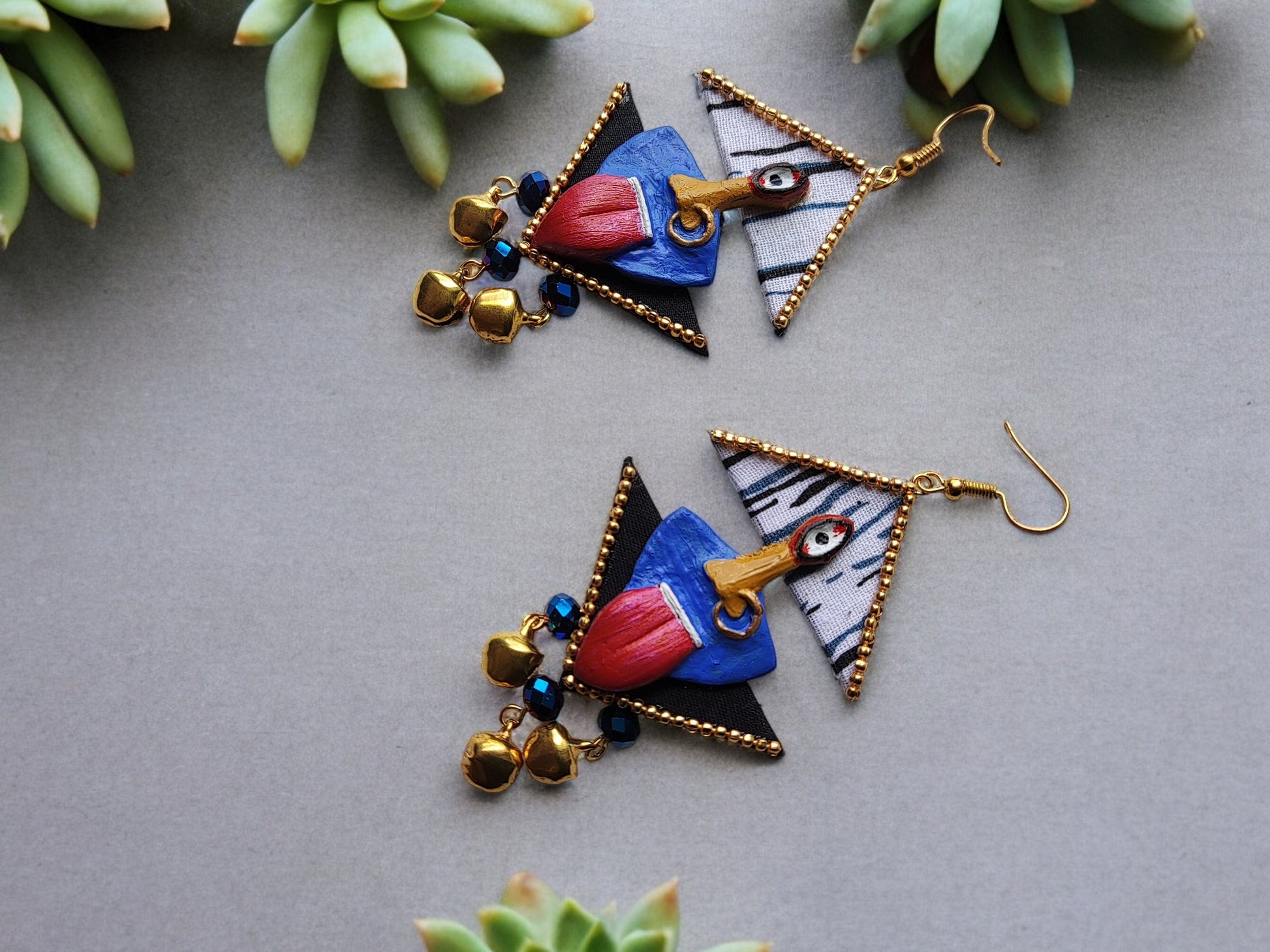 <p data-mce-fragment="1">Discover the divine elegance of Kaalika Fabric Earrings. Each pair in this unique collection is expertly crafted with a fabric and clay combination, inspired by the powerful goddess Kali ma. Elevate any outfit with these exclusive, one-of-a-kind pieces. Experience luxury and style like never before.</p>