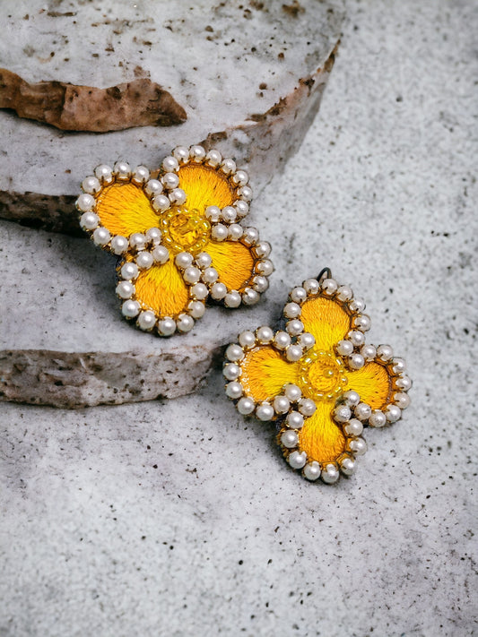 Exquisitely crafted with hand-stitched flower pattern fabric, our Summer embroidery Earrings are a true work of art. Each earring is carefully handmade, making them unique and exclusive. Elevate your style with these luxurious earrings, perfect for any summer occasion.