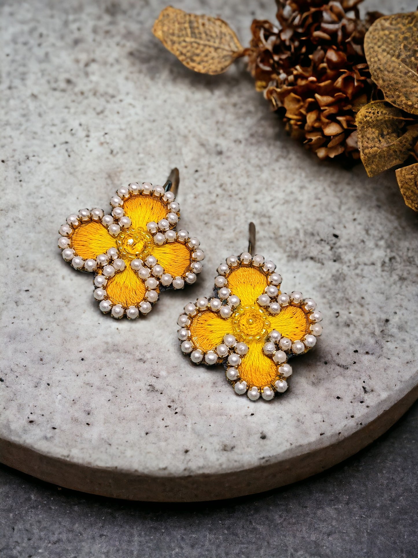 Exquisitely crafted with hand-stitched flower pattern fabric, our Summer embroidery Earrings are a true work of art. Each earring is carefully handmade, making them unique and exclusive. Elevate your style with these luxurious earrings, perfect for any summer occasion.