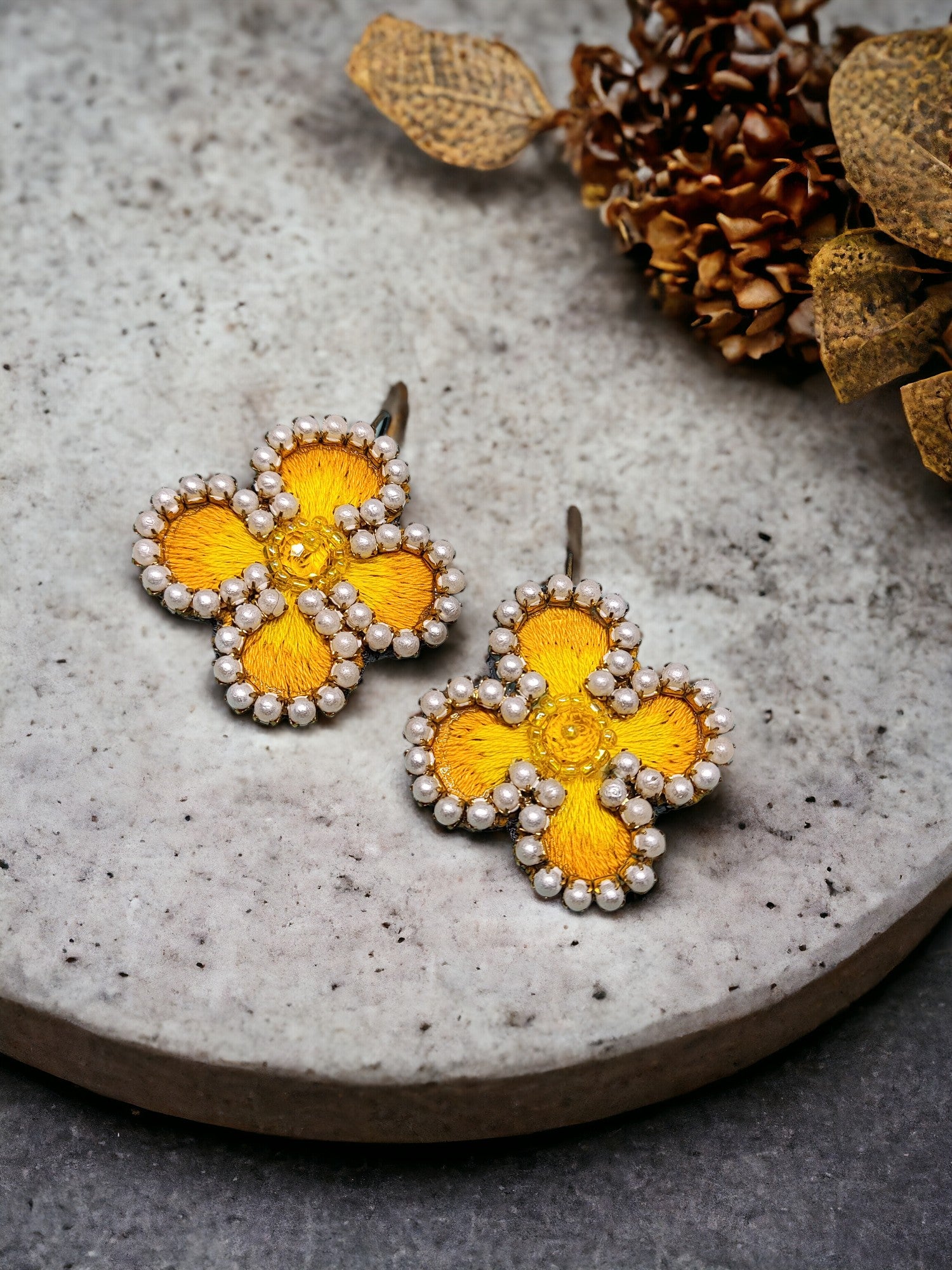 Exquisitely crafted with hand-stitched flower pattern fabric, our Summer embroidery Earrings are a true work of art. Each earring is carefully handmade, making them unique and exclusive. Elevate your style with these luxurious earrings, perfect for any summer occasion.