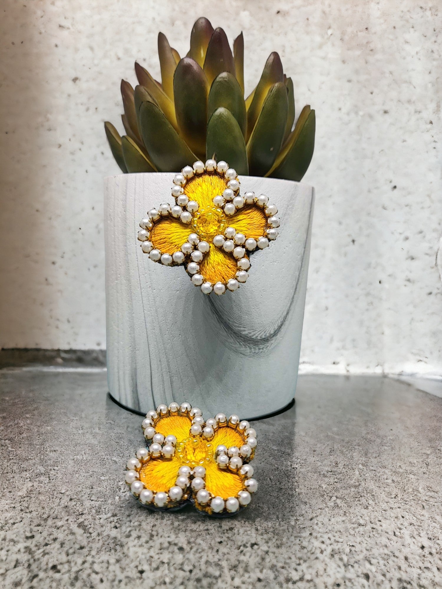 Exquisitely crafted with hand-stitched flower pattern fabric, our Summer embroidery Earrings are a true work of art. Each earring is carefully handmade, making them unique and exclusive. Elevate your style with these luxurious earrings, perfect for any summer occasion.