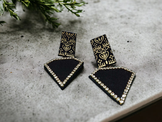 Discover luxury with our sustainable Black Beauty Fabric Earrings. Each pair crafted with precision and care, exuding elegance and commitment to conscious fashion. Elevate your style today.