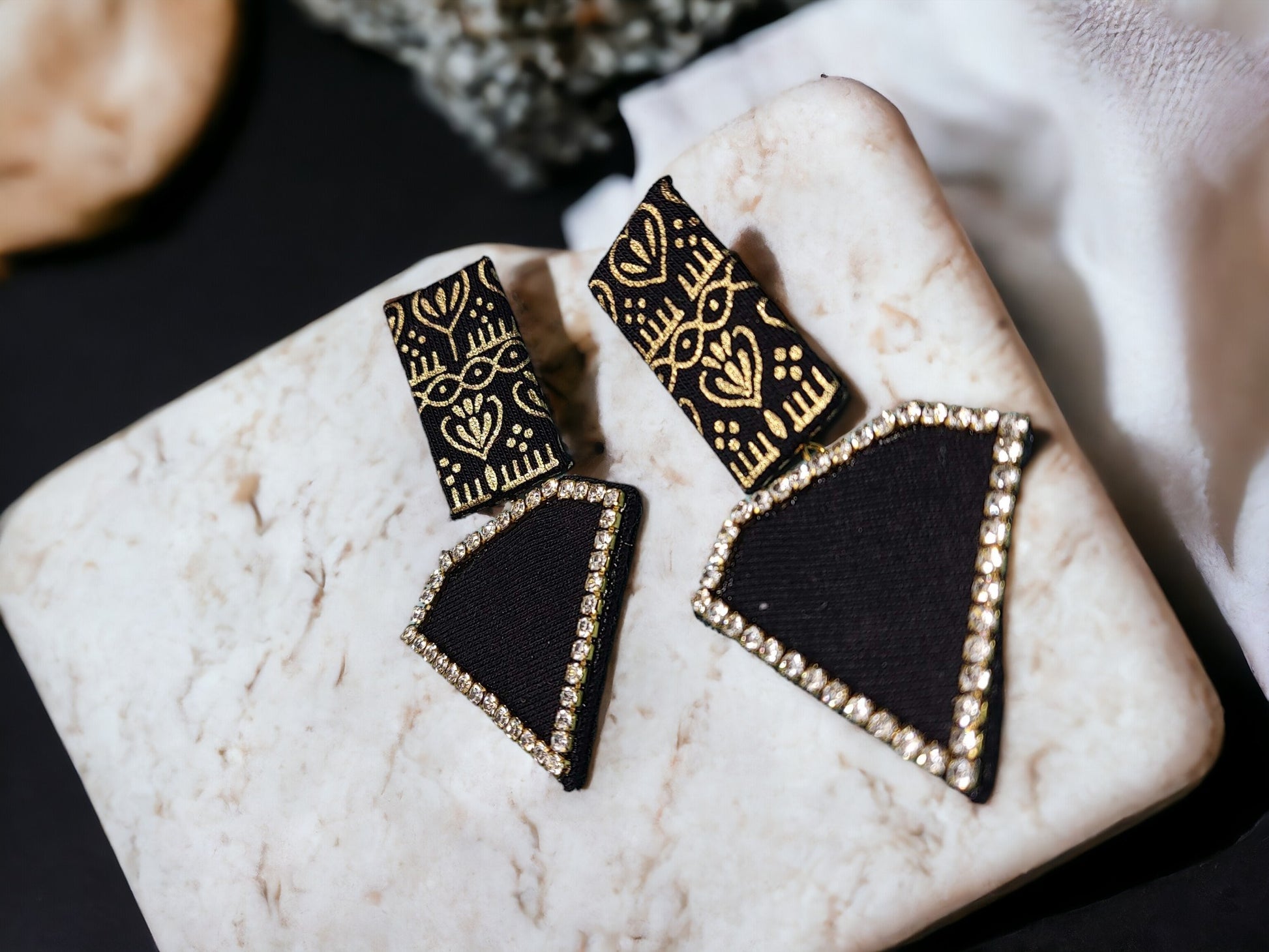 Discover luxury with our sustainable Black Beauty Fabric Earrings. Each pair crafted with precision and care, exuding elegance and commitment to conscious fashion. Elevate your style today.