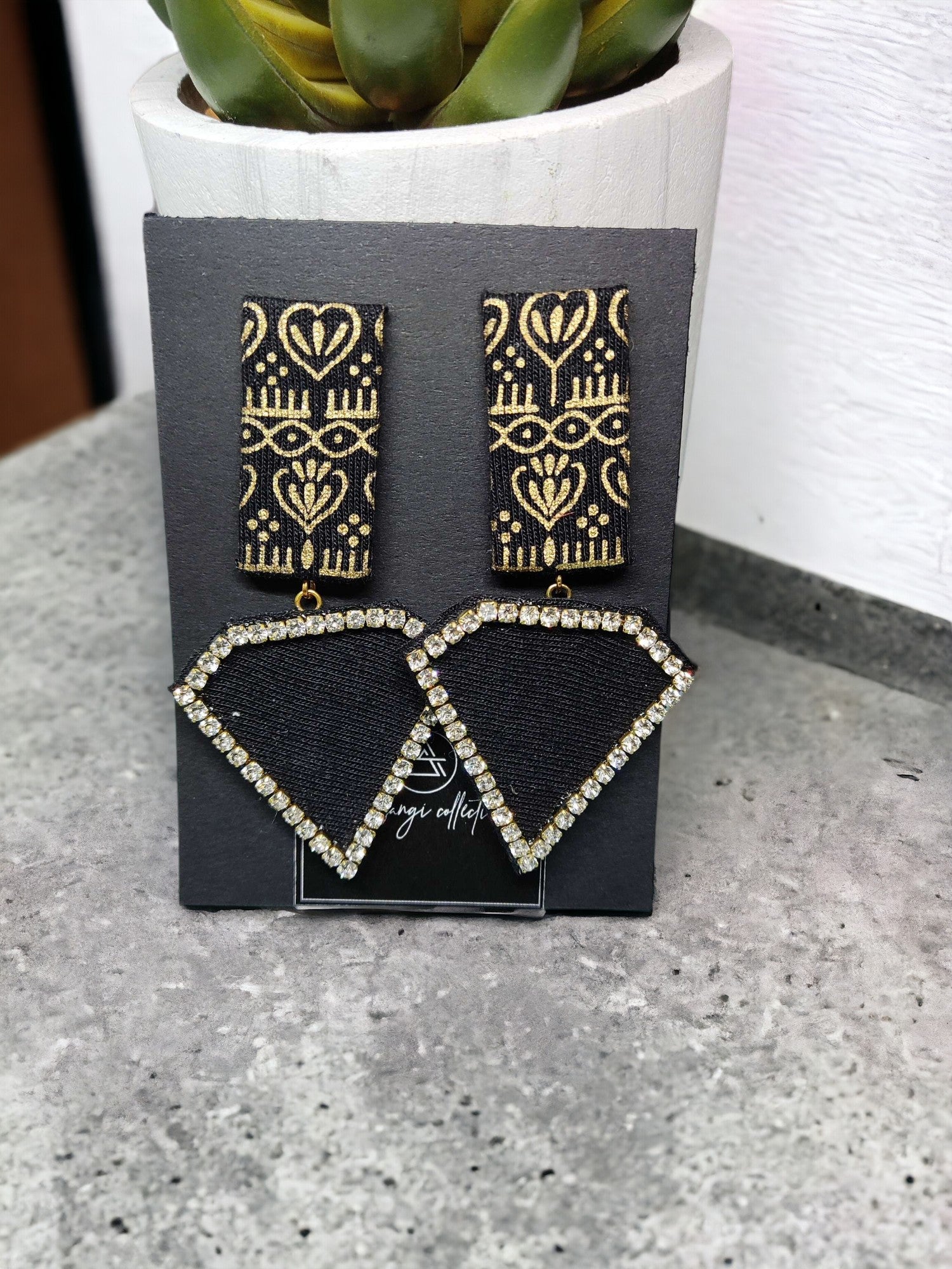 Discover luxury with our sustainable Black Beauty Fabric Earrings. Each pair crafted with precision and care, exuding elegance and commitment to conscious fashion. Elevate your style today.